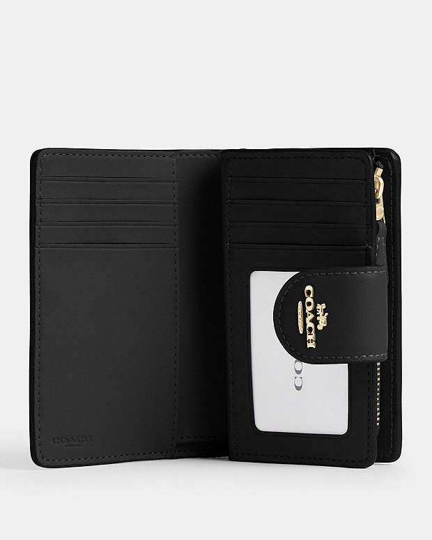 Coach medium corner zip wallet